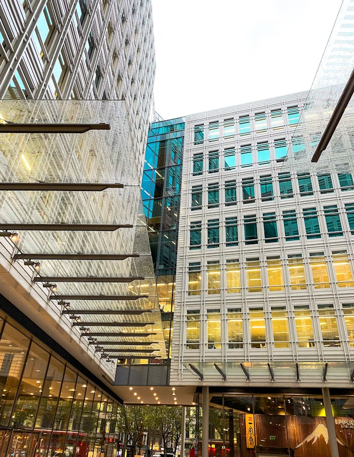 Contemporary office buildings with glass facades in downtown London, showcasing urban architecture.